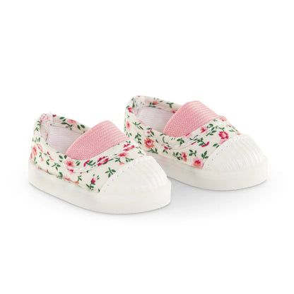 Side view of the flowered doll sneakers showing the flexible sole and the secure strap closure