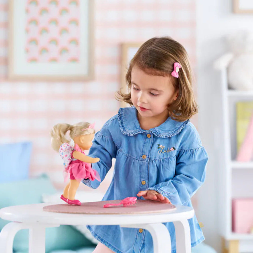 Size reference showing Rosy at 20cm (8 inches), a travel-friendly Corolle doll for days out