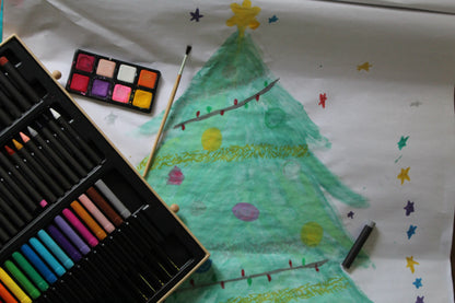 Child colouring with pencils from the Djeco Big Box of Colours during creative play