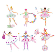 Finished ballet dancer figures standing assembled and coloured on a flat surface