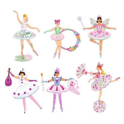 Finished ballet dancer figures standing assembled and coloured on a flat surface