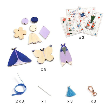 Finished butterfly bag charms made with the Djeco DIY kit, ready to clip onto school bags and pencil cases