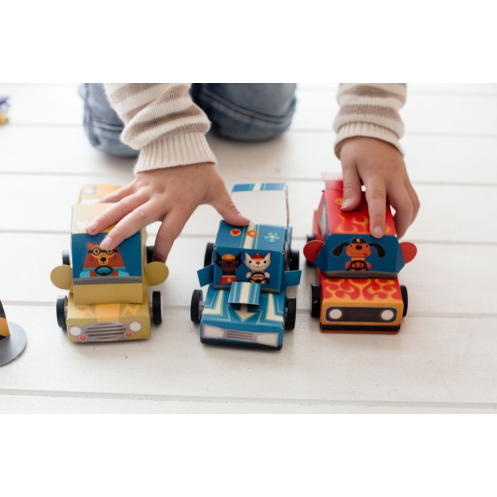 Sticker sheets from the Djeco Do It Yourself Grand Prix kit for decorating the race cars