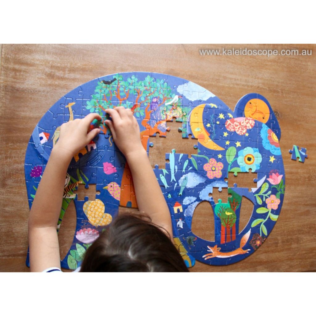 Child fitting pieces into the Djeco elephant art jigsaw puzzle at a table, building focus and patience