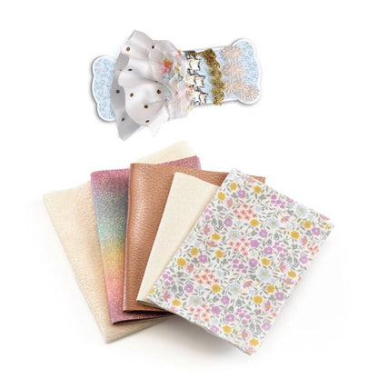 Contents of the Djeco Fashion by Caroline workshop laid out, including illustrated sheets and craft materials