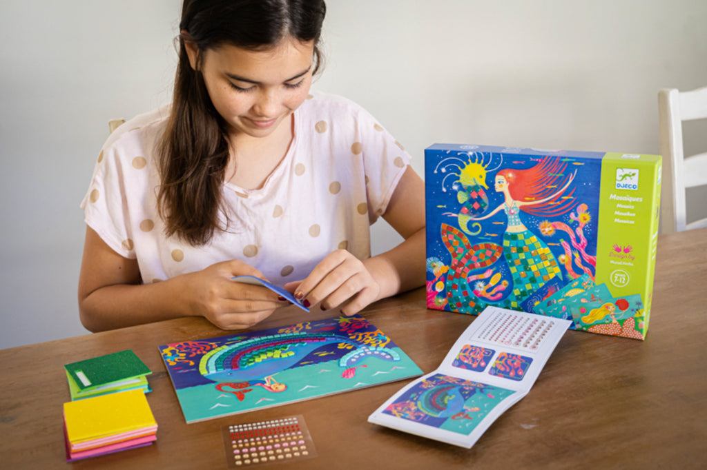 Close-up of glitter foam squares forming the mermaid's tail on a Djeco mosaic board