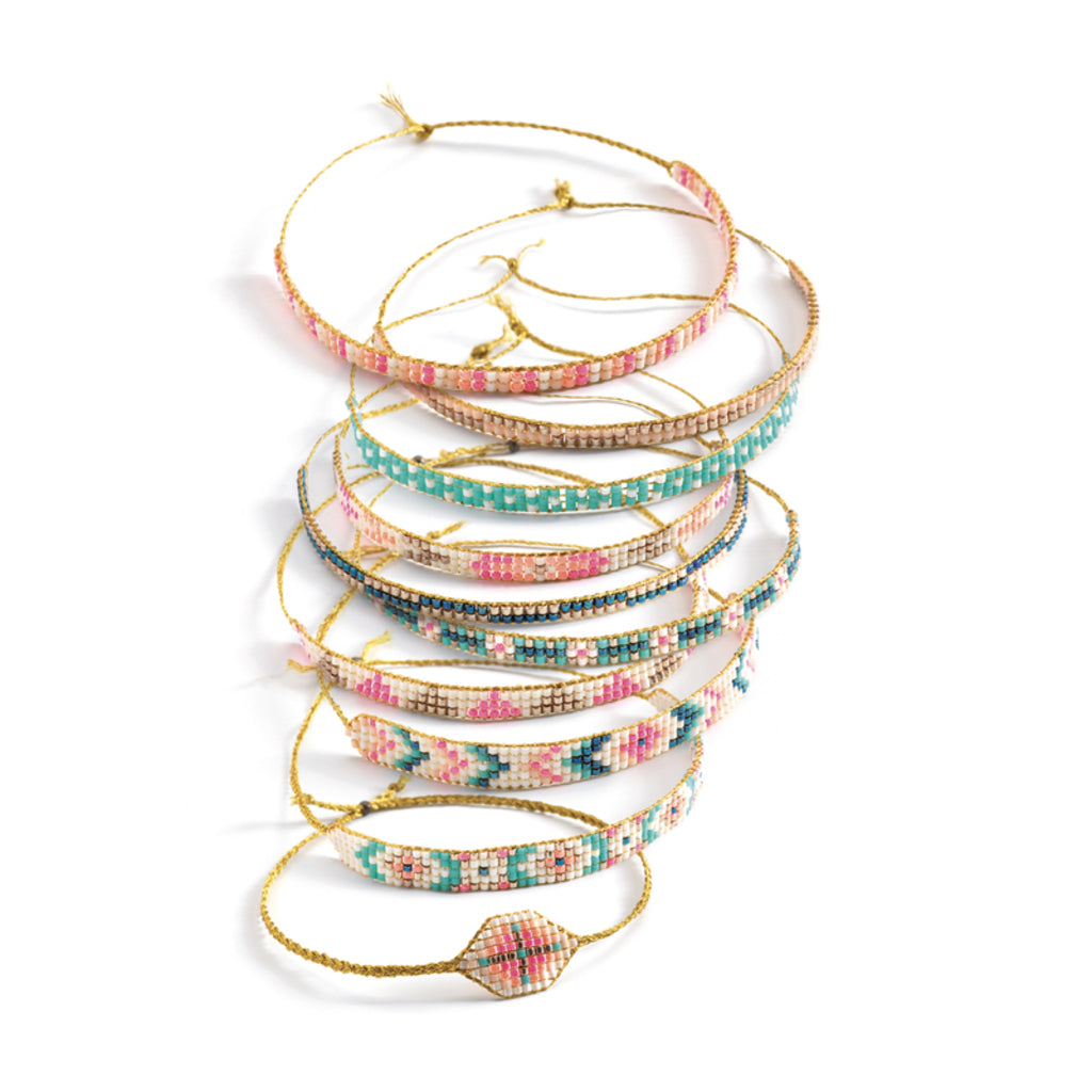 Elastic threads and clasps included in the Djeco Tiny Beads bracelet making set for finishing bracelets