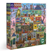 eeBoo Piece & Love The Alchemist's Home 1000 piece jigsaw puzzle box featuring a colourful cutaway illustration of a mysterious house filled with detailed rooms, characters and animals.