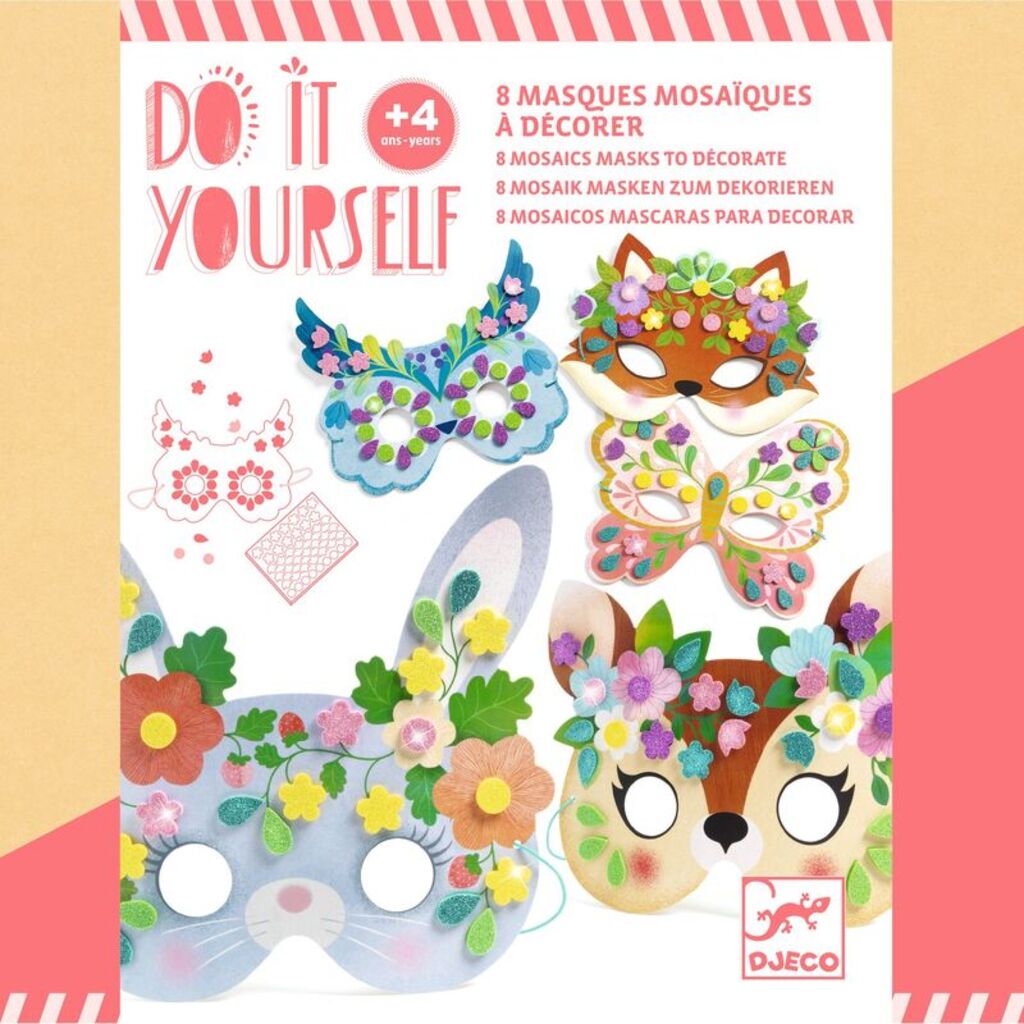 child at a table pressing mosaic stickers onto a forest animal mask with the kit open