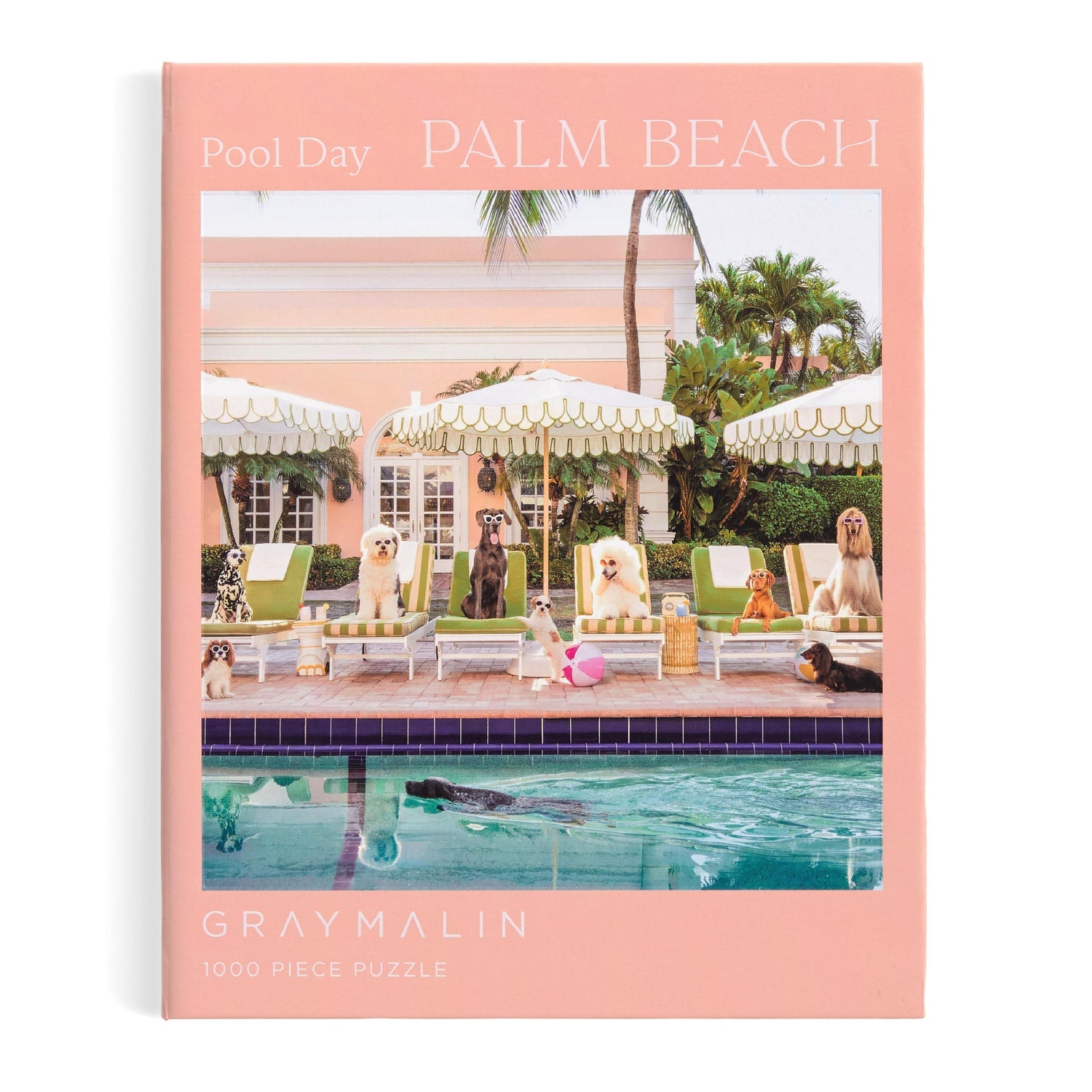 Puzzle box with a poolside scene featuring dogs and a palm tree, labeled 'Pool Day Palm Beach' by Gray Malin.