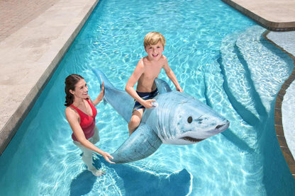 Older child lying on the 1.83m Bestway inflatable shark ride-on float in a swimming pool