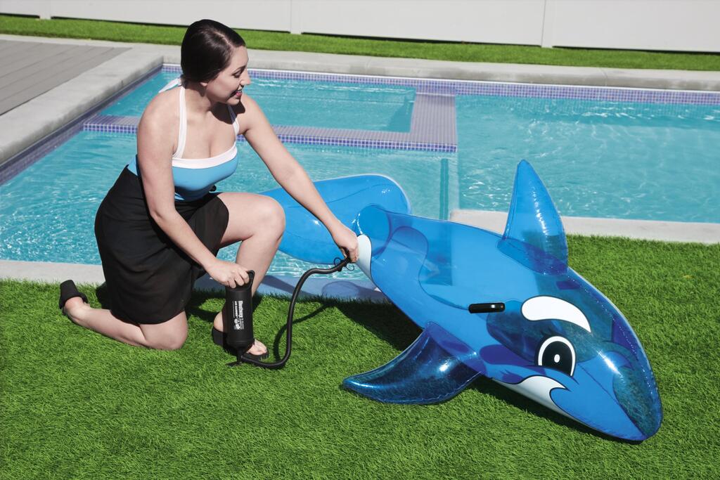 Child lying on the Bestway inflatable whale pool float while floating in a swimming pool