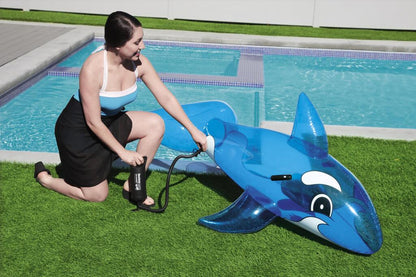 Child lying on the Bestway inflatable whale pool float while floating in a swimming pool