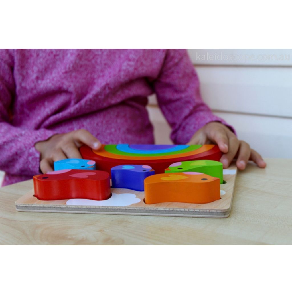 Chunky wooden pieces from the Kiddie Connect bird and rainbow puzzle sized for little hands