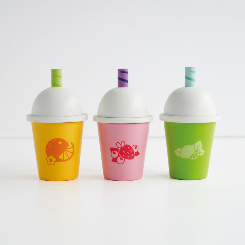 Le Toy Van Honeybake fruit smoothies set shown with a play kitchen for take away games