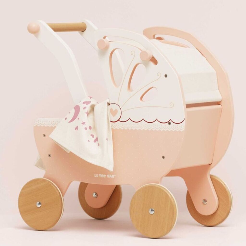 Side view of the Le Toy Van retro wooden doll pram showing its classic carriage shape and large push handle