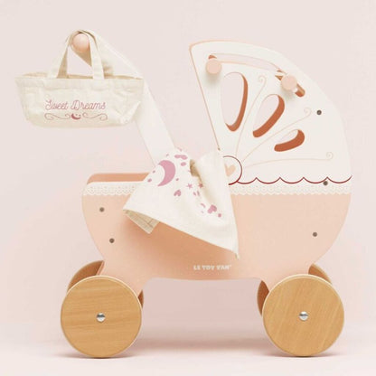 Retractable fabric canopy and padded mattress inside the Le Toy Van retro wooden doll pram for dolls and soft toys
