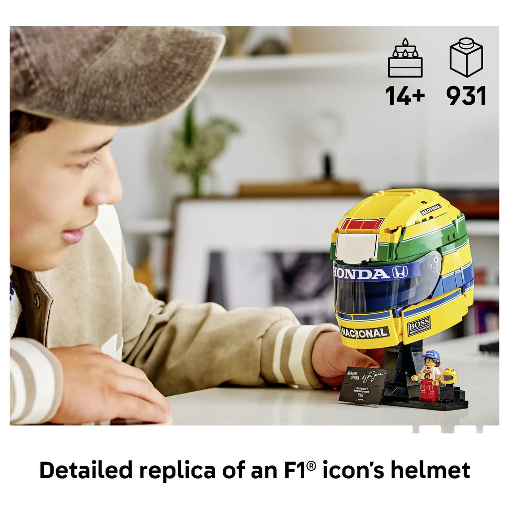 Ayrton Senna LEGO minifigure in race suit with a Senninha T-shirt, shown with its small printed helmet