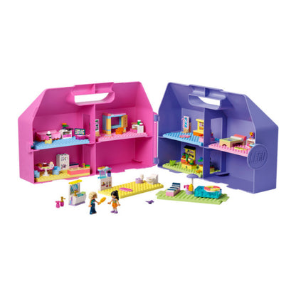 Close-up of the furniture and interior detail inside the 355-piece LEGO dollhouse suitcase