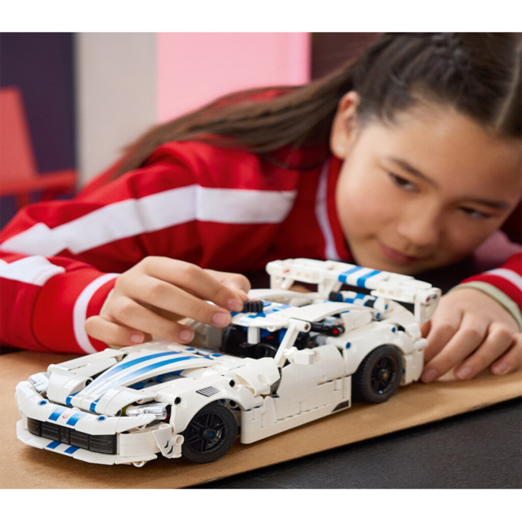LEGO 42234 Dodge Viper GTS-R displayed on a desk beside other model cars at home