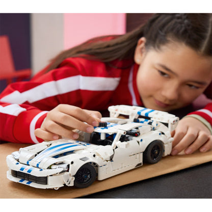 LEGO 42234 Dodge Viper GTS-R displayed on a desk beside other model cars at home