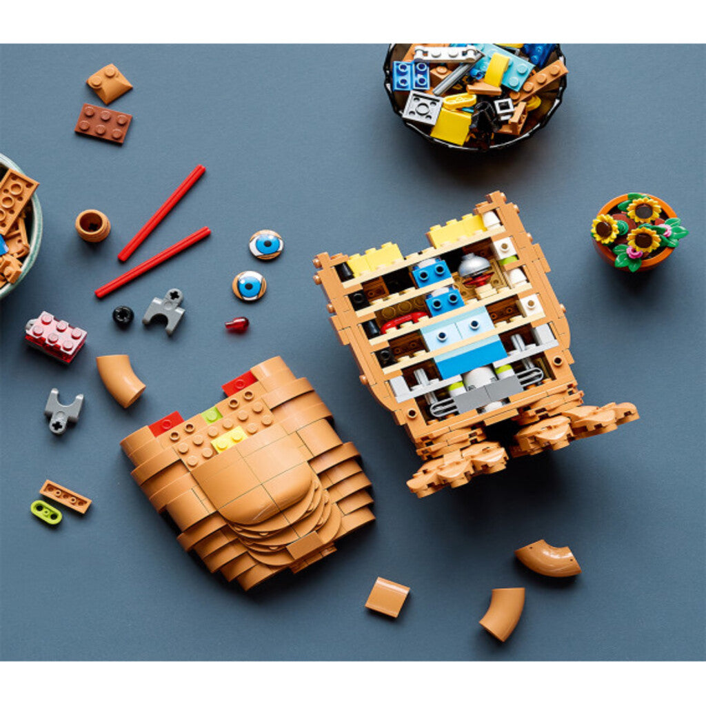 LEGO E.T. the Extra-Terrestrial 21370 model displayed on a shelf in a home film room