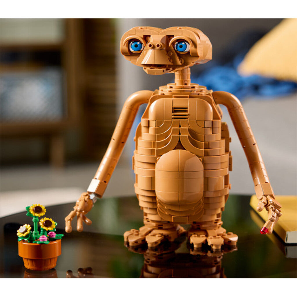 Side view of the 24cm tall LEGO E.T. the Extra-Terrestrial model shown beside its box