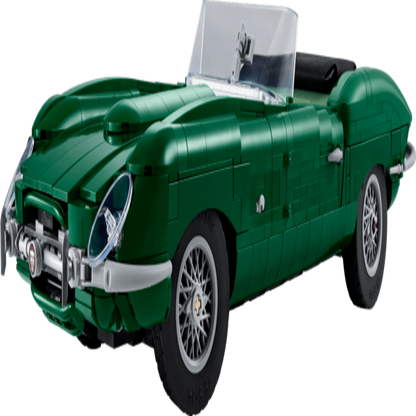 LEGO Jaguar E-Type 11381 model car displayed under warm lighting on a dark tabletop