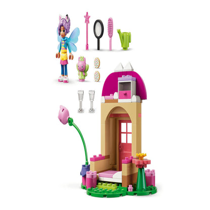 Child arranging the LEGO Kitty Fairy's Garden House 11212 on a play table at home