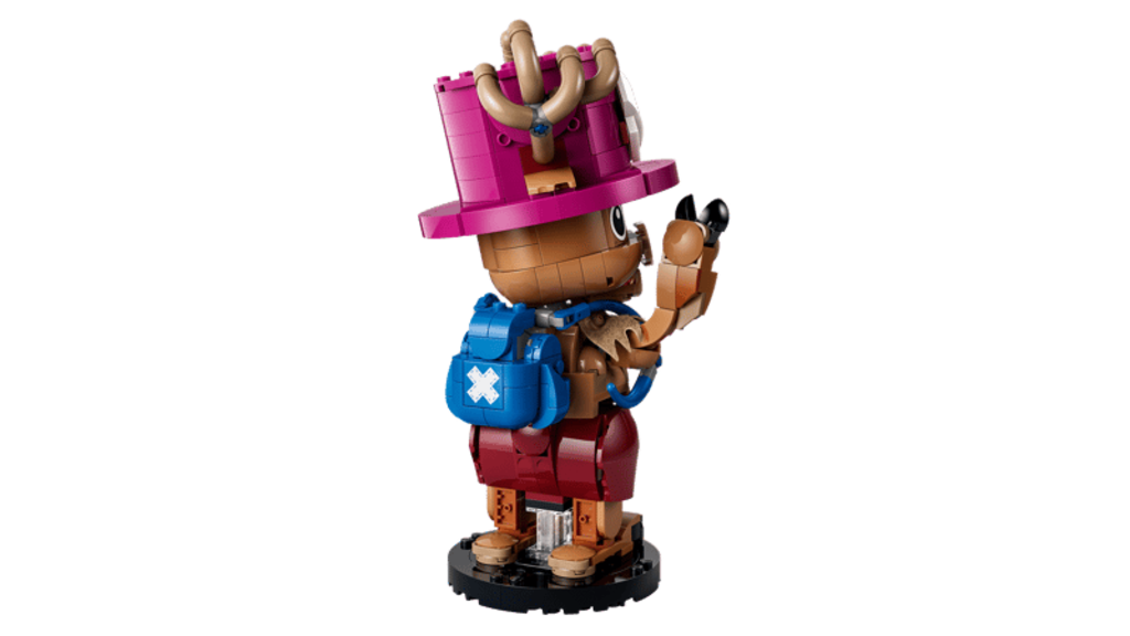 LEGO Tony Tony Chopper 75643 model displayed on a desk beside anime figures and books