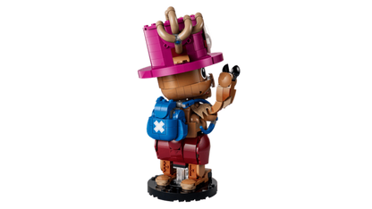 LEGO Tony Tony Chopper 75643 model displayed on a desk beside anime figures and books