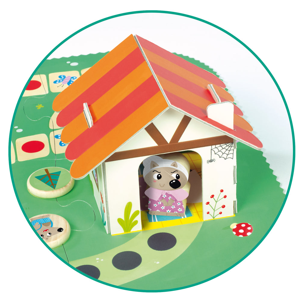 Six wooden tree tokens and the wooden die from the Goula Little Red Riding Hood board game