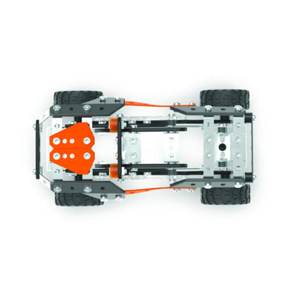 Top-down view of a toy vehicle chassis with four black wheels, a gray metal frame, and bright orange mechanical components, shown on a plain white background.