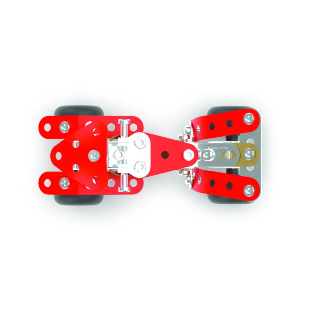 A top-down view of a red robotic claw assembly with black wheels, silver metal gears, and white plastic components, centered on a solid white background.