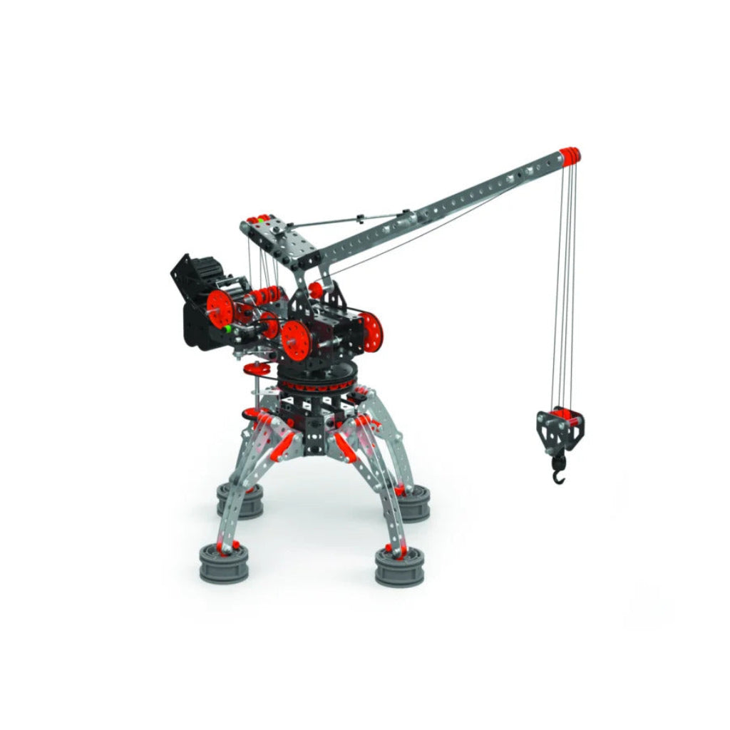 Completed Meccano Pro motorised construction crane with extended boom, suspended hook, orange pulleys and four metal support legs.
