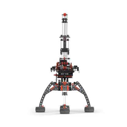 Front view of Meccano Pro motorised crane built with metal construction pieces, pulleys, cables and four supporting legs.