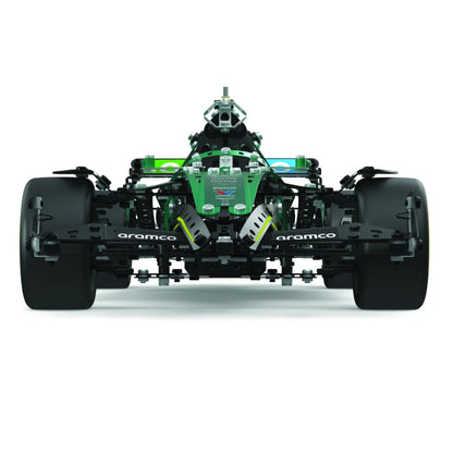A front-facing view of a green and black Formula 1 racing car chassis, resembling a Mercedes-AMG F1 car, on a clean white background. Visible branding includes 'aramco' on the front and rear wheel spacers and 'Mercedes' on the nose of the car.
