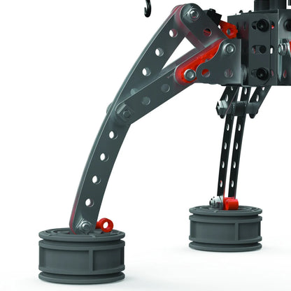 Close-up of Meccano Pro crane supporting legs constructed from perforated metal strips with bolts and circular feet.