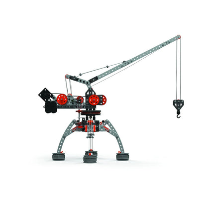 Side view of assembled Meccano Pro crane showing extended metal boom, motor housing, pulley system and lifting hook.