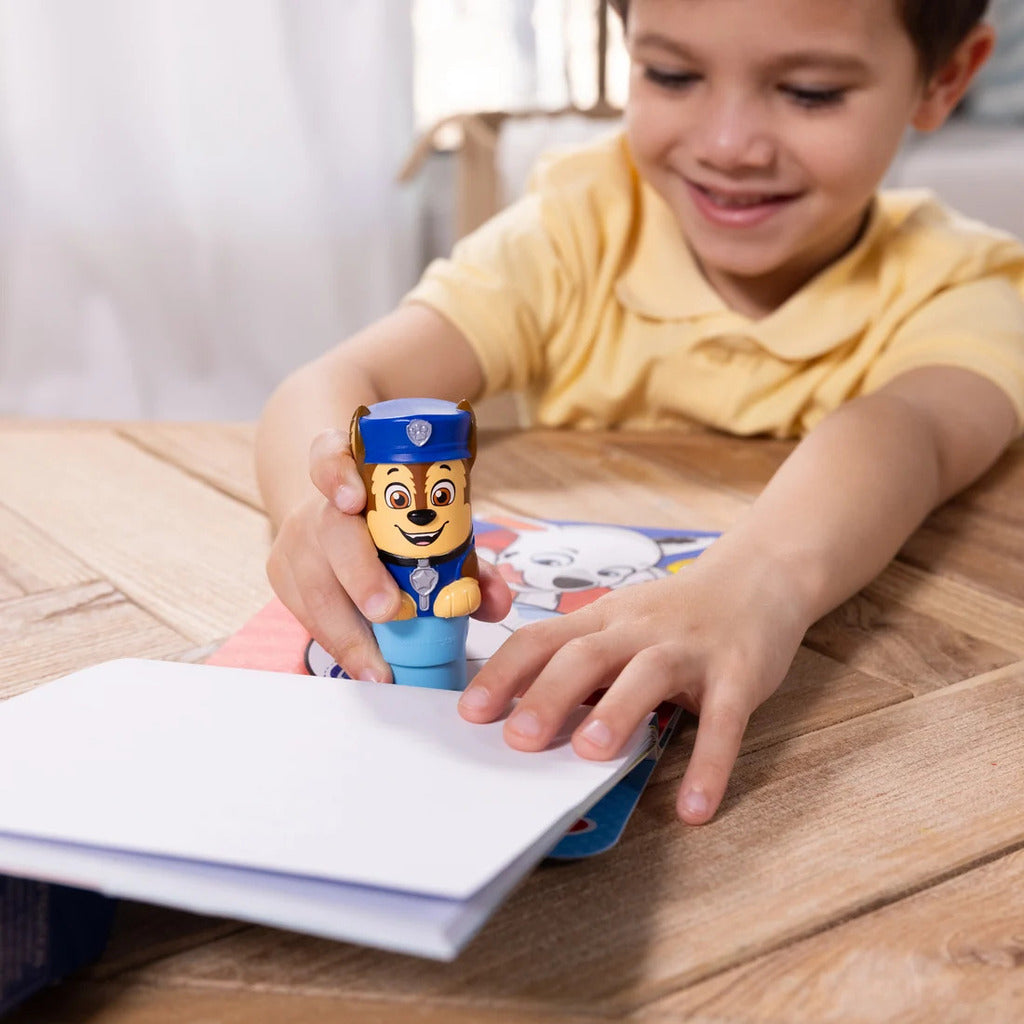 Chase sticker stamper clipped into the activity pad's built-in storage for mess-free travel