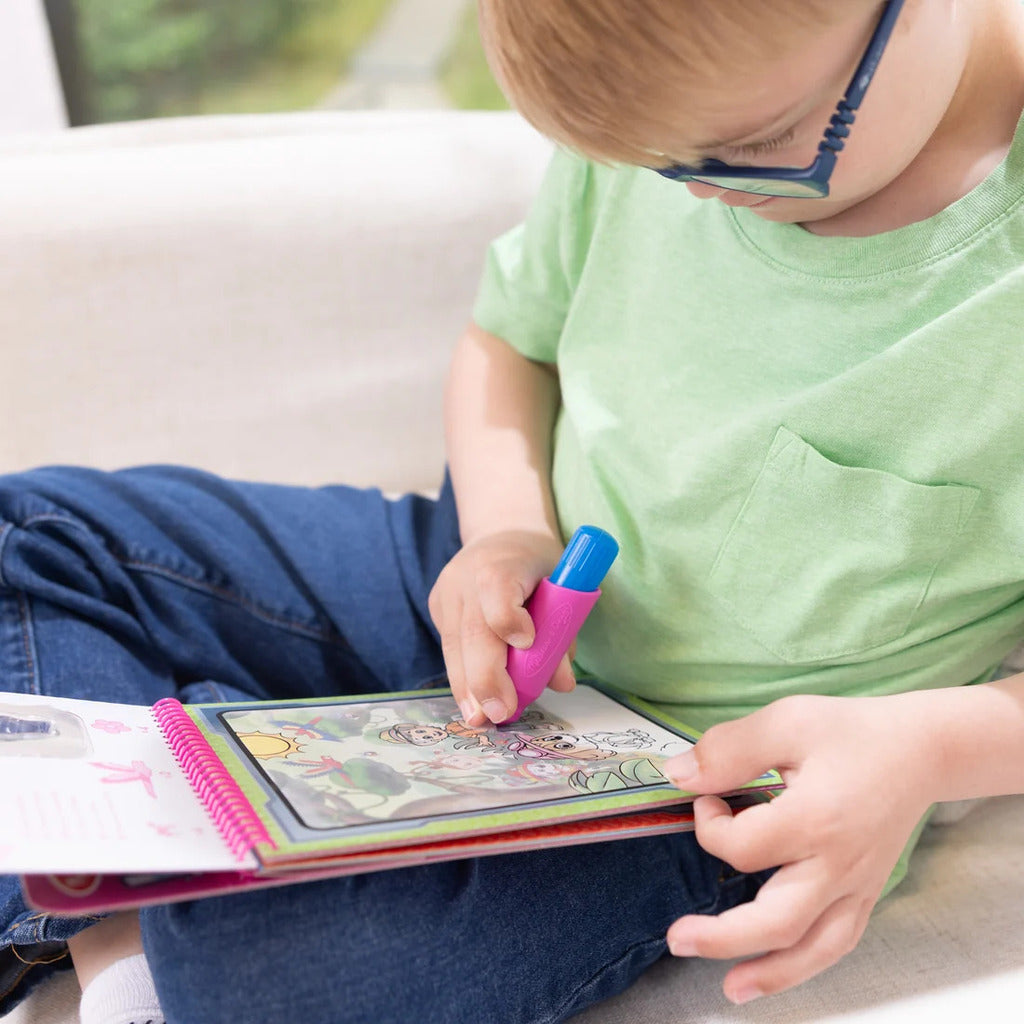 Skye sticker stamper clipped into the activity pad's built-in storage for mess-free travel