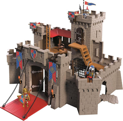 Playmobil Knights 72112 castle playset fully assembled, featuring stone-look castle walls, towers, a red drawbridge, ladders, medieval banners and armoured knight figures.