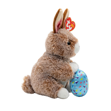 Side view of the Praline the Brown Rabbit Regular 15cm Ty plush with the red Ty Heart swing tag attached