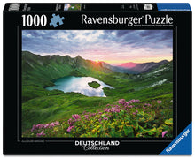 Ravensburger Allgäuer Bergsee 1000 piece puzzle featuring alpine mountain lake, wildflowers and German mountain scenery