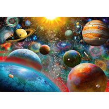 Close-up detail of brightly coloured planets against deep space in the Planetary Vision puzzle