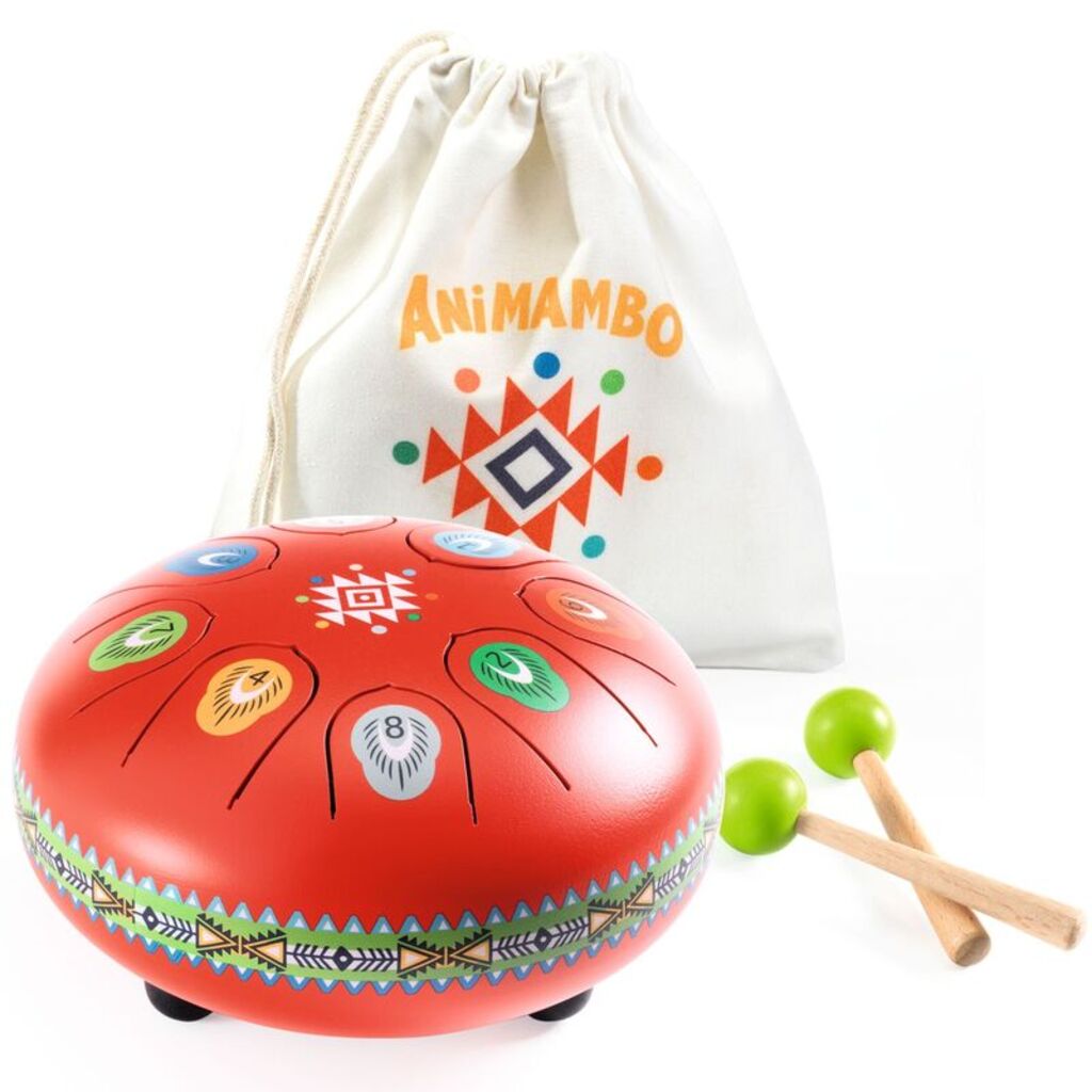 child playing Djeco red metal tongue drum while exploring rhythm and simple musical melodies