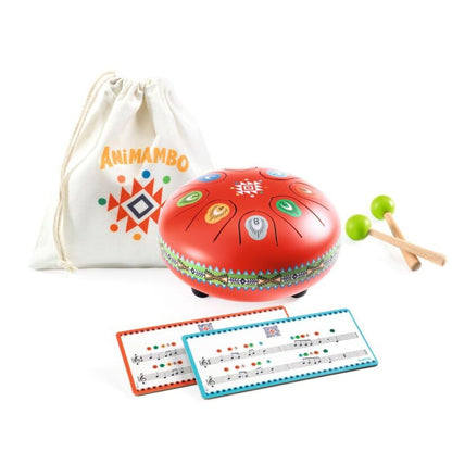 side view of the red metal tongue drum showing its rounded body and Animambo illustrations