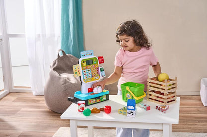 Scan & Learn Checkout shown with all play food pieces and the scanner laid out beside it