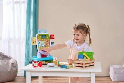 Two toddlers playing shop together at the LeapFrog Scan and Learn Checkout with play groceries