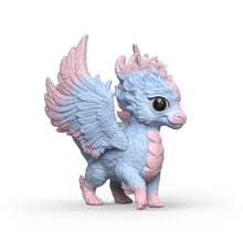 Close-up of the baby dragon's pearlescent wing membranes and sculpted scale detail along its back